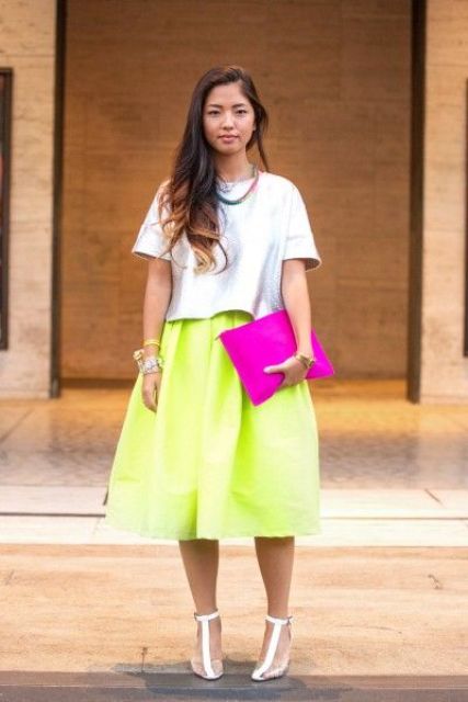 an oversized light blue tee, a neon green midi skirt, T ankle strap shoes