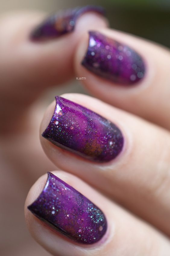 purple galaxy nails with glitter touches