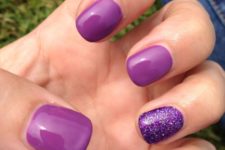 18 purple nails with an accent glitter ones