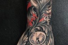 Black and red clock tattoo on the arm