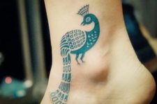 Blue peacock tatoo on the ankle