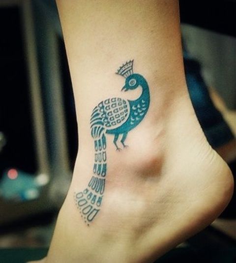 Blue peacock tatoo on the ankle