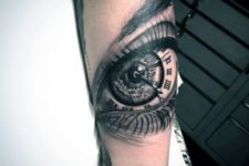 Clock and eye tattoo