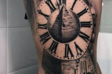 Clock and pyramid tattoo