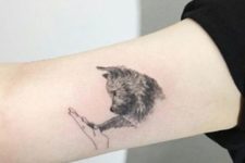 Cute dog tattoo on the arm