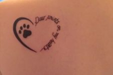 Dog and heart tattoo on the shoulder