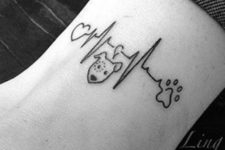 Dog and heartbeat tattoo