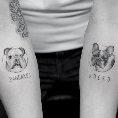 Dog tattoos on both arms