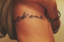 Gorgeous mountain tattoo on the right side