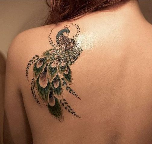 Green tattoo on the shoulder