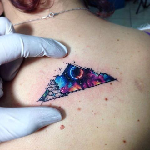 Mountain tattoo in the space theme