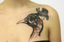Peacock head tattoo on the shoulder
