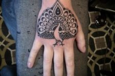 Peacock tattoo on the hand