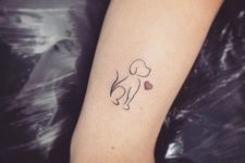 Small dog tattoo with red heart
