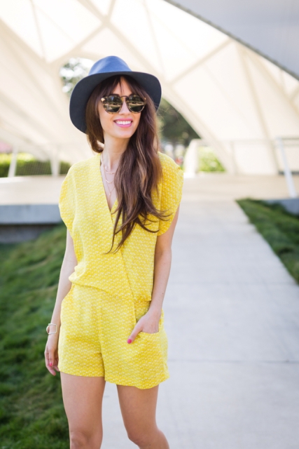 With hat and oversized sunglasses