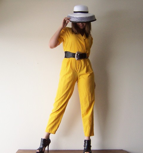 With hat, black belt and cutout shoes