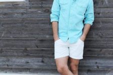 With light blue shirt and white shorts