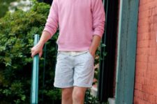 With pink sweatshirt and printed shorts