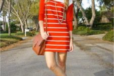 With striped mini dress and brown bag
