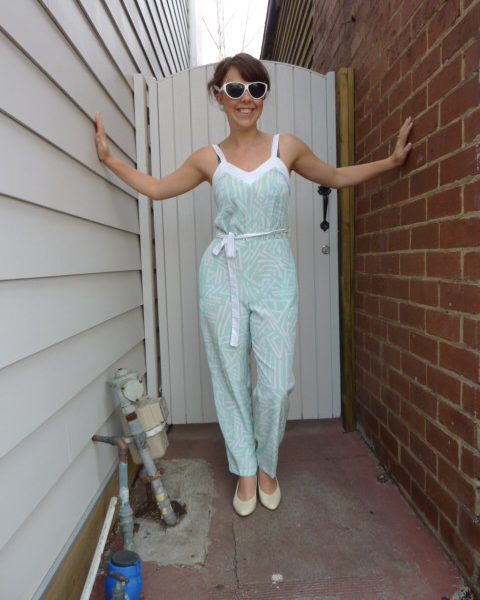 With white pumps and white sunglasses
