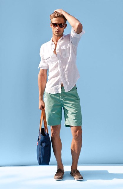 With white shirt, denim bag and mint green shorts