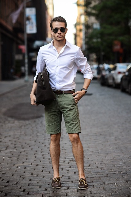 With white shirt, olive green shorts and black bag
