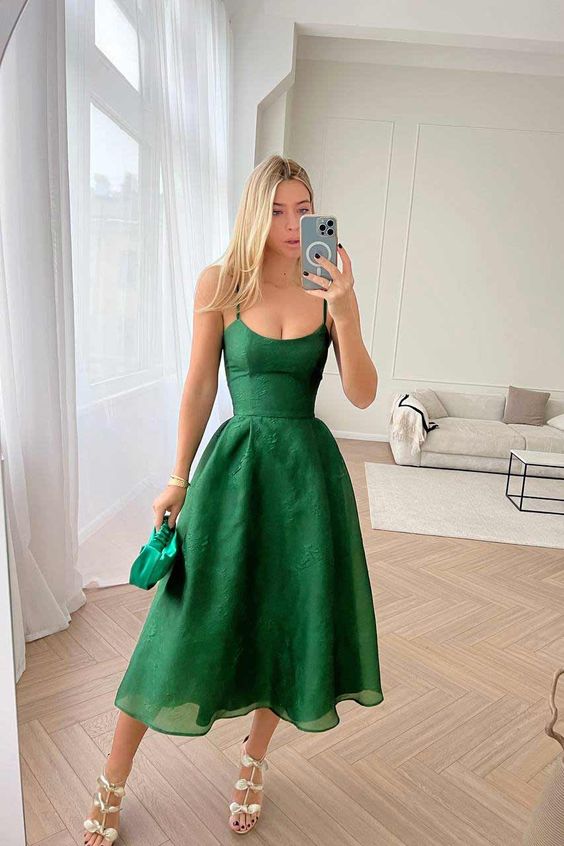 a green A-line midi dress, gold petal shoes and a small green bag are a cute and lovely outfit for graduation