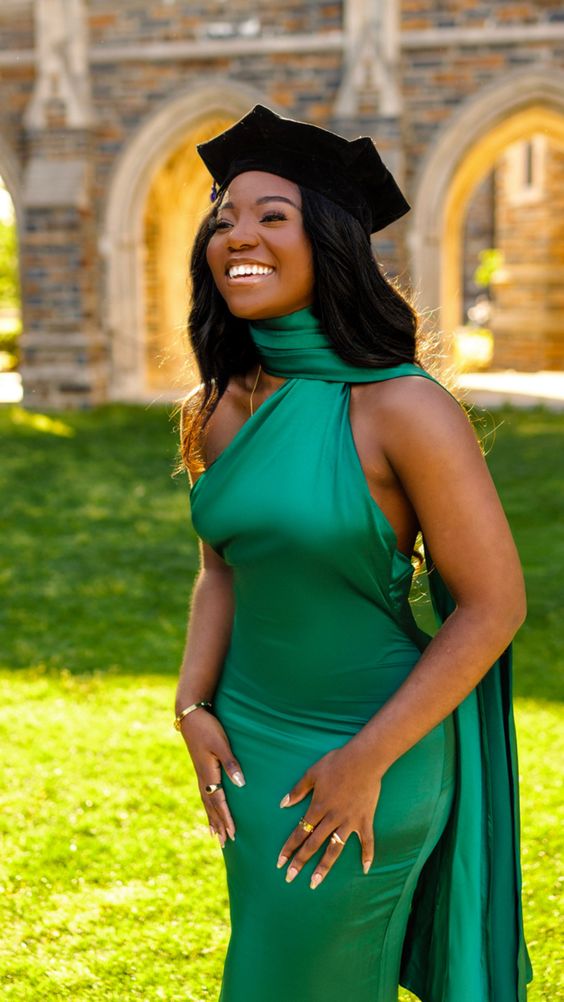 a green stain bodycon dress wiht an asymmetrical neckline and a scarf is a bold and cool idea for graduation