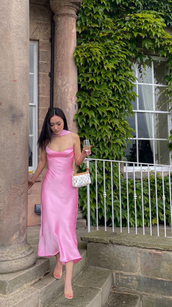 a light pink midi slip dress paired with clear shoes and a small bag are a cool combo for a graduation party