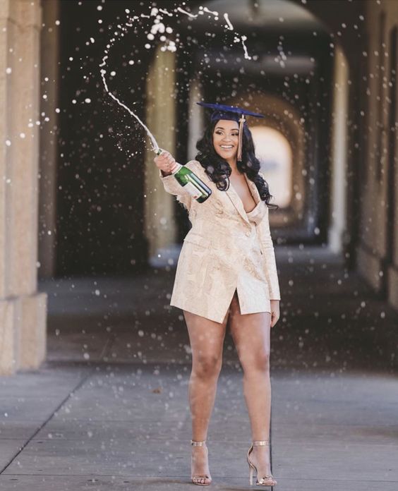 a nude blazer mini dress, metallic shoes and a navy hat for a bold and sexy graduation outfit
