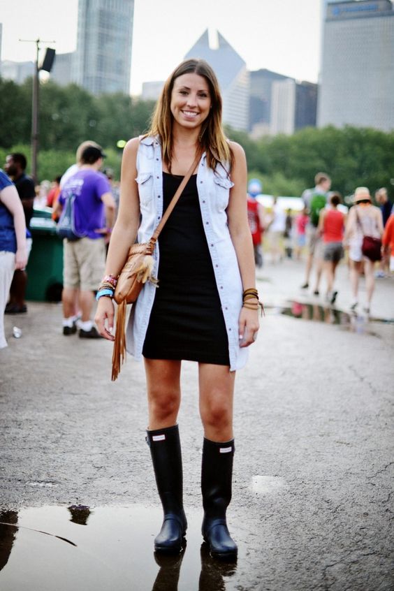 a black mini dress, a long denim vest and black rainboots are all that you need