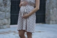 02 a neutral polka dot sleeveless dress with a v neckline and lace up creamy shoes