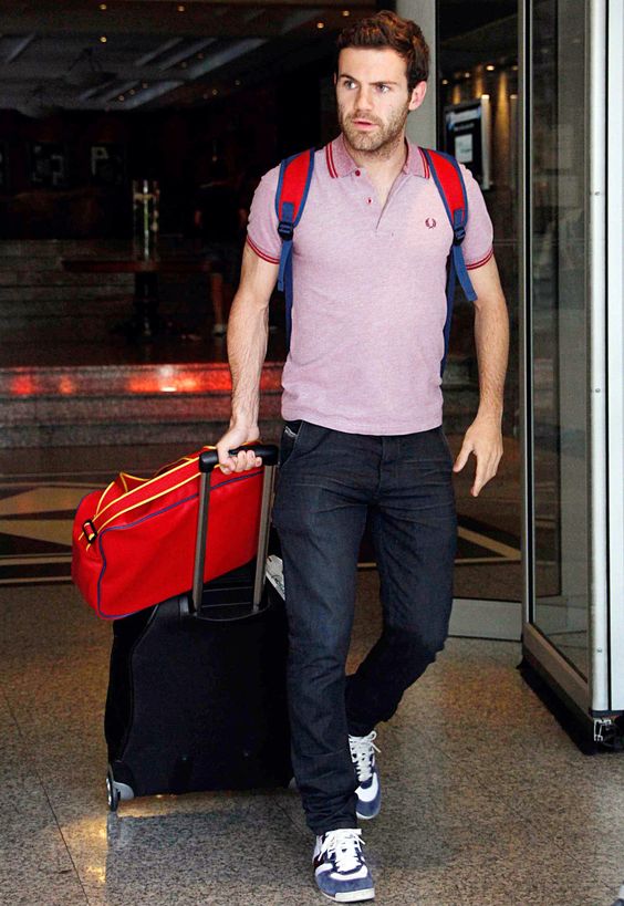 black jeans, a pink polo shirt, navy chucks and a backpack