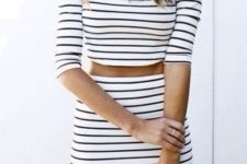 05 a black and white striped set with a mini skirt and a crop top with half sleeves