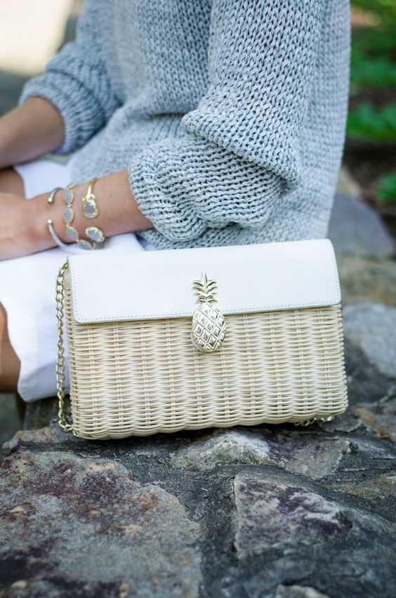 a straw and leather neutral bag with a pineapple detail is a cute summer piece