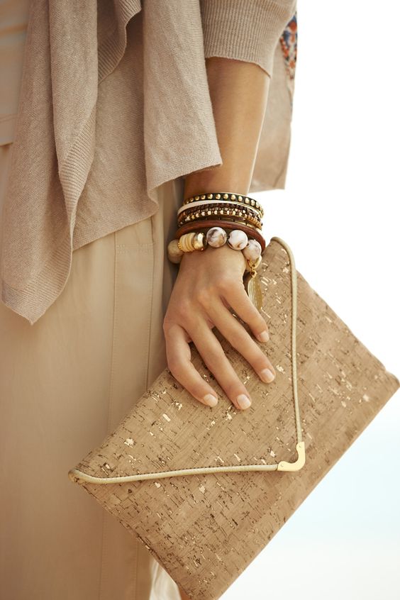 a cork clutch with copper leaf decor and metallic detailing