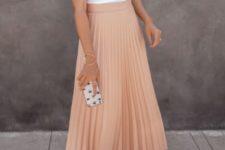 10 a white halter neckline top, a blush pleated midi skirt and pink shoes