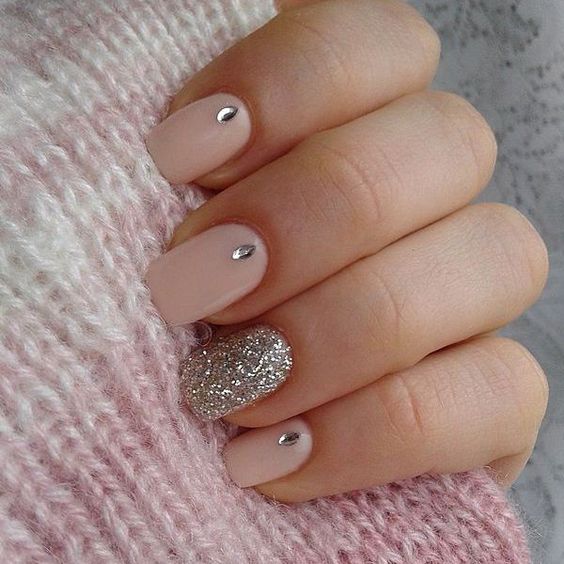 pink nails with a silver glitter accent one and some rhinestones