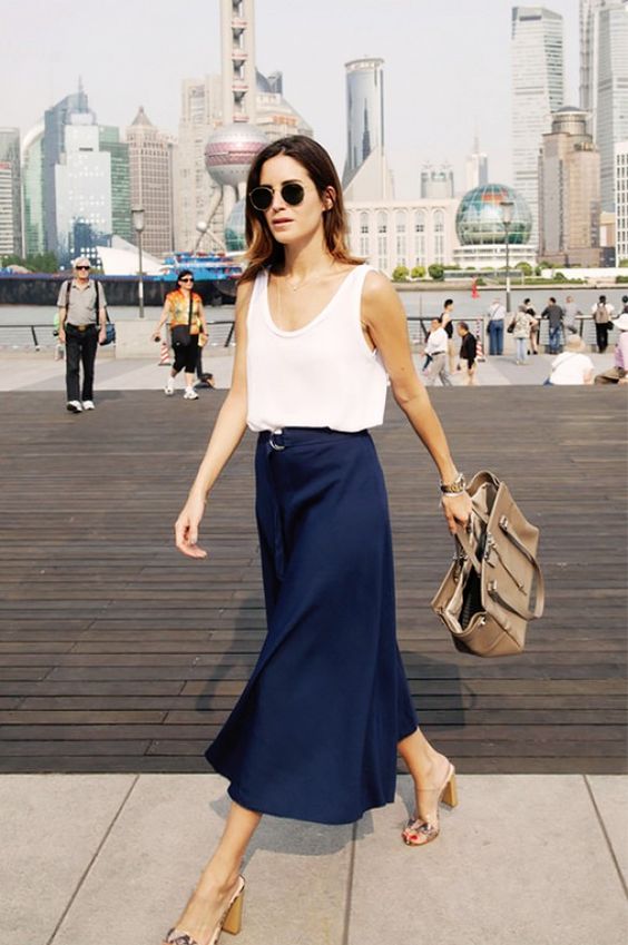 a navy midi skirt, a white strap top and comfy heels