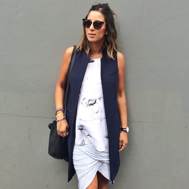 a printed top, a wrap skirt and a long navy vest can even hide your bump if you need