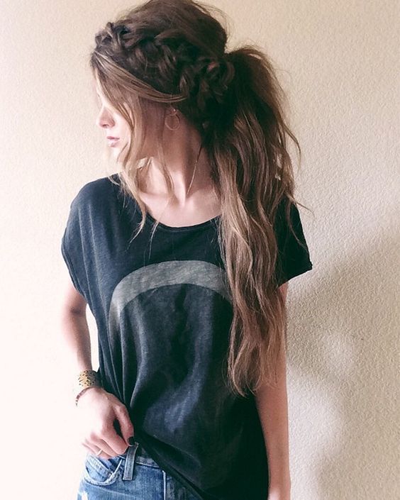 loose and messy low ponytail with a large braid and some hair down