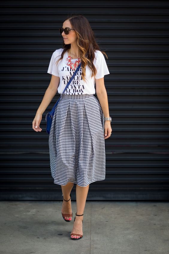 a printed tee, a statement necklace, a gingham midi skirt and ankle strap sandals