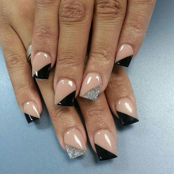 geometric nails with black and silver glitter triangles