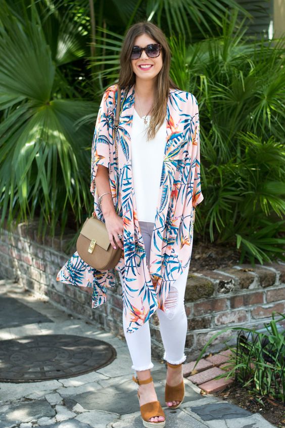 white distressed jeans, a white top, mustard suede shoes and a pink tropical print kimono over
