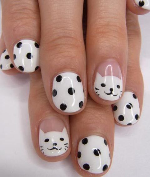 white with black polka dot nails and accent kitty ones