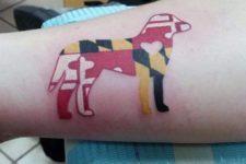 Abstract dog tattoo on the arm