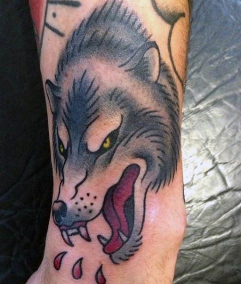 Angry wolf tattoo idea