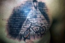Bicycle tattoo on the chest