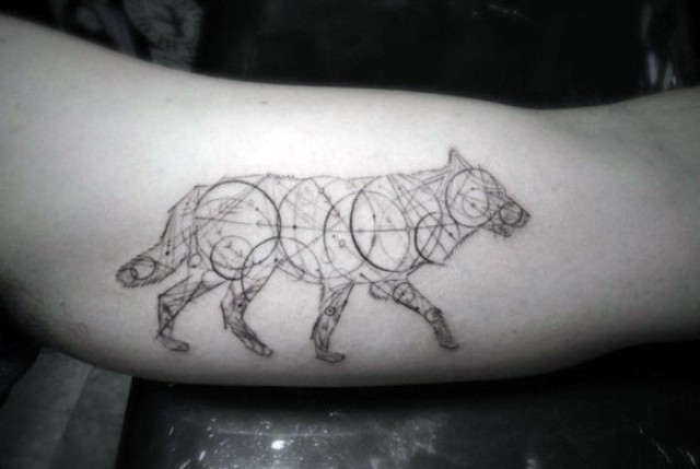 Black contour tattoo on the arm