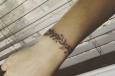 Black tattoo with leaves